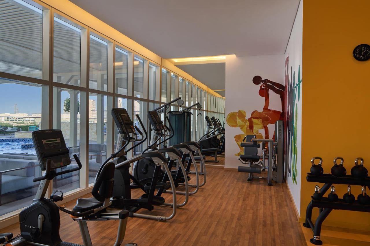 Movenpick Jumeirah Village Triangle Dubai Esterno foto The gym at the hotel
