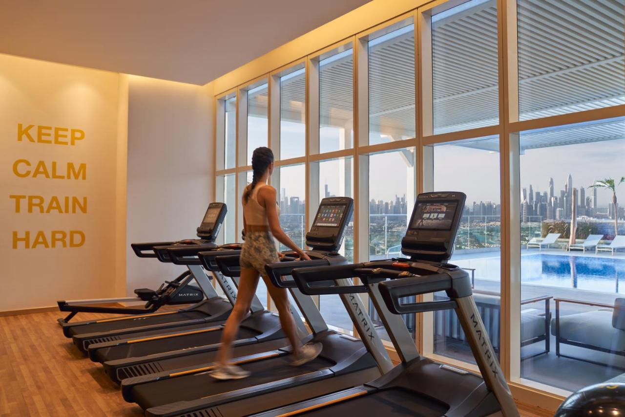 Movenpick Jumeirah Village Triangle Dubai Esterno foto The gym at the hotel