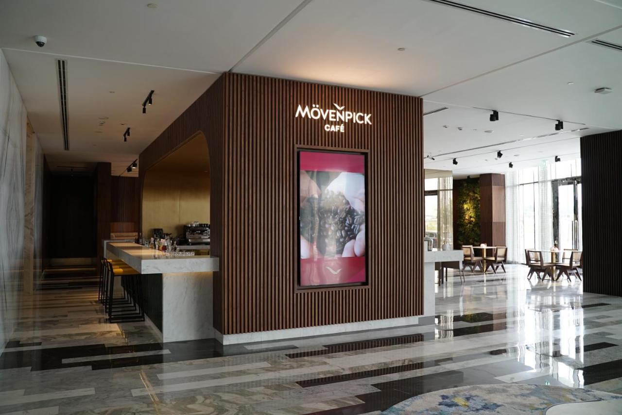 Movenpick Jumeirah Village Triangle Dubai Esterno foto Mövenpick Café in the lobby of the Kempinski Hotel, Amman, Jordan
