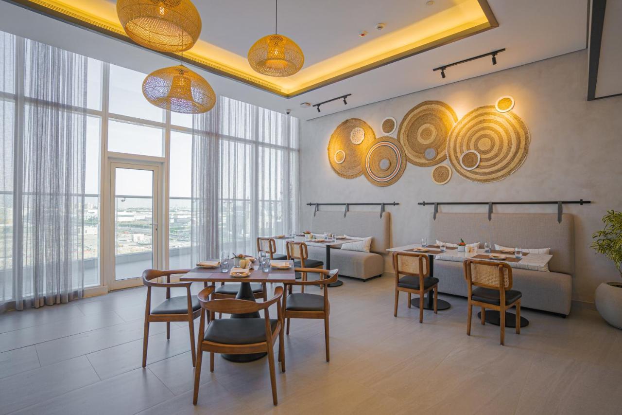 Movenpick Jumeirah Village Triangle Dubai Esterno foto The restaurant