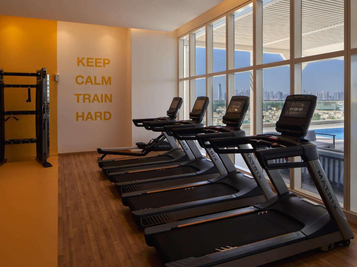 Movenpick Jumeirah Village Triangle Dubai Esterno foto The gym at the hotel