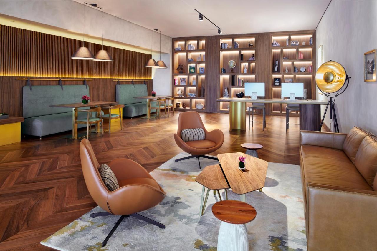 Movenpick Jumeirah Village Triangle Dubai Esterno foto The Library at The Hari