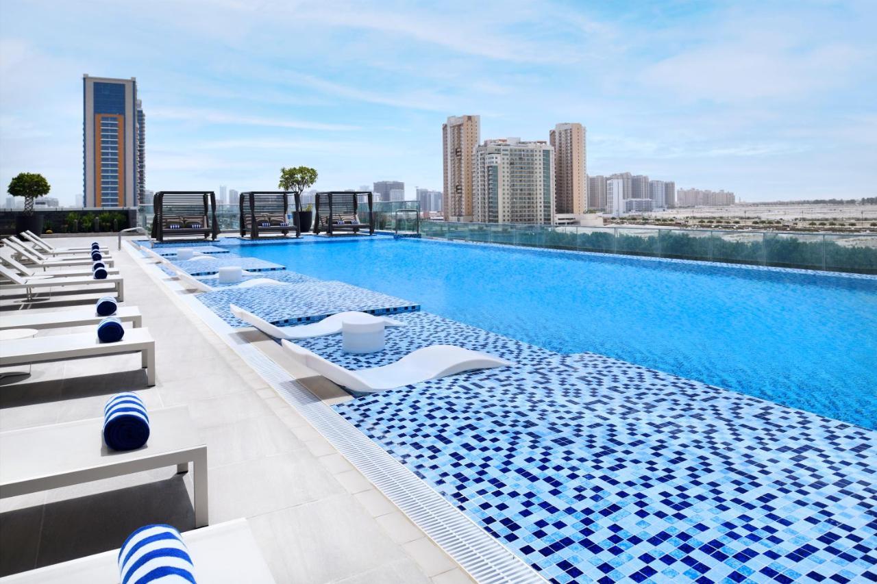 Movenpick Jumeirah Village Triangle Dubai Esterno foto Rooftop pool